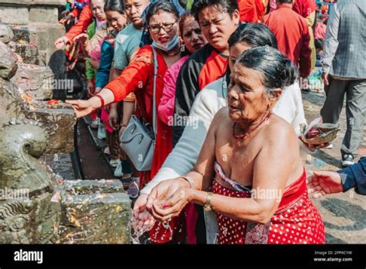 Woman prays outside Matatirtha temple on Nepali Mother's Day - Xinhua